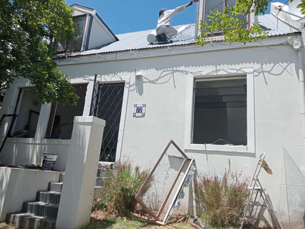 Aluminium window installation in progress with old steel frames removed in Cape Town