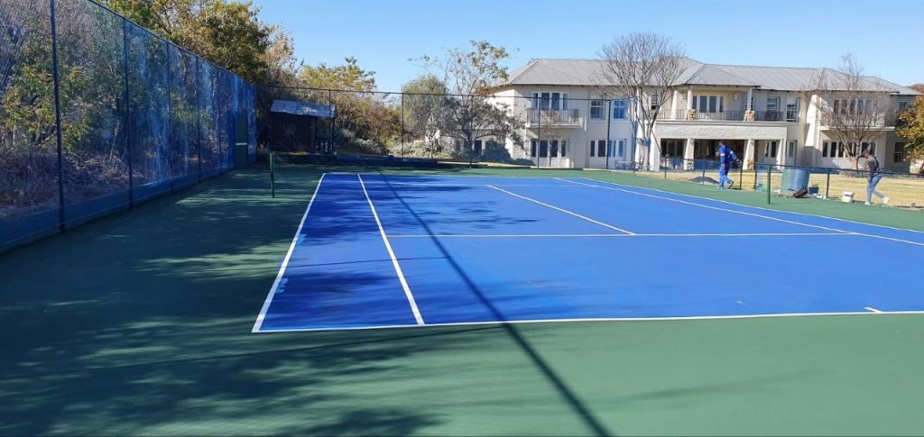 School tennis court resurfaced in blue acrylic