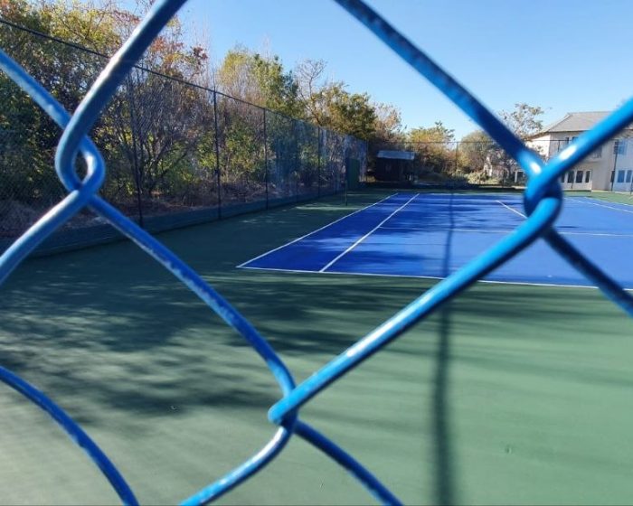 Tennis court perimeter fencing installed by Kiki Projects